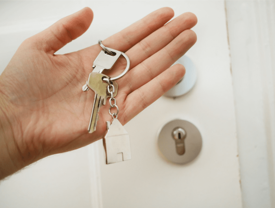 Hand holding house keys